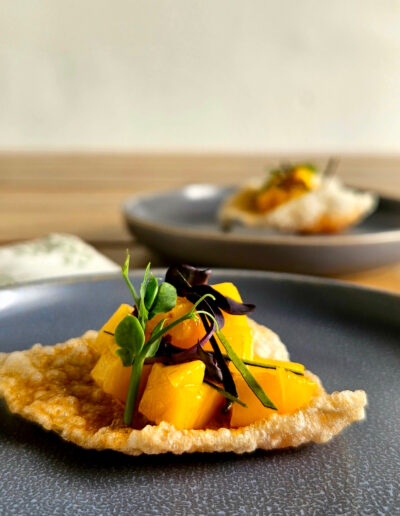 Mango on rice cracker with chilli oil